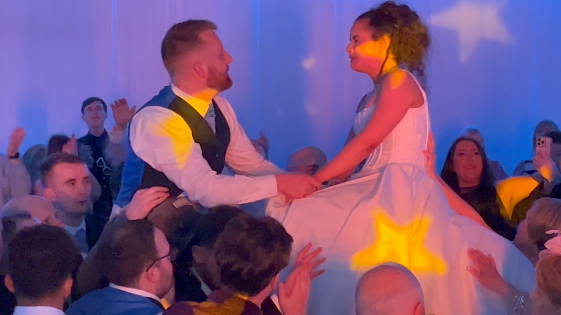 Bride and groom lifted high by cheering wedding guests at Royal Musselburgh Golf Club Prestonpans evening reception — Premier Disco Scotland