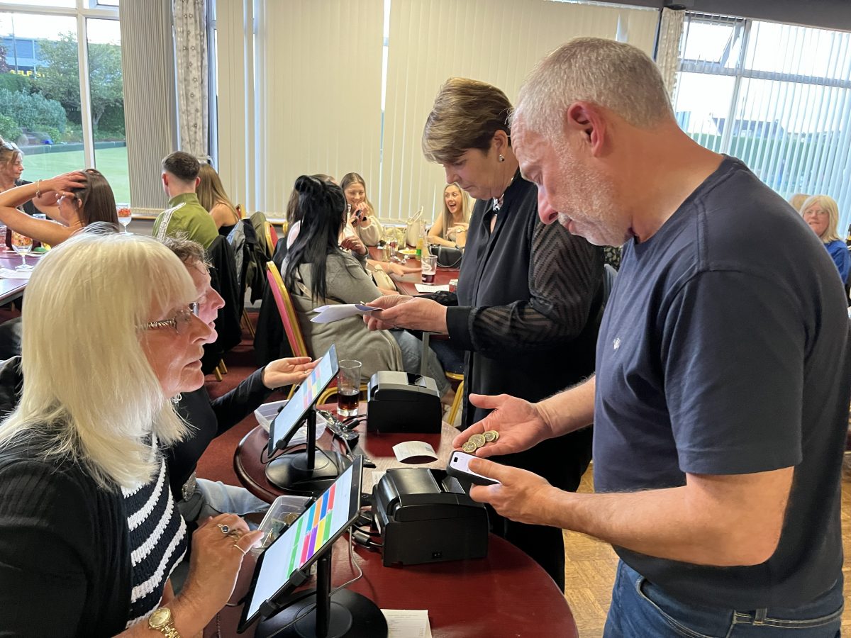 Guests placing bets tote desk