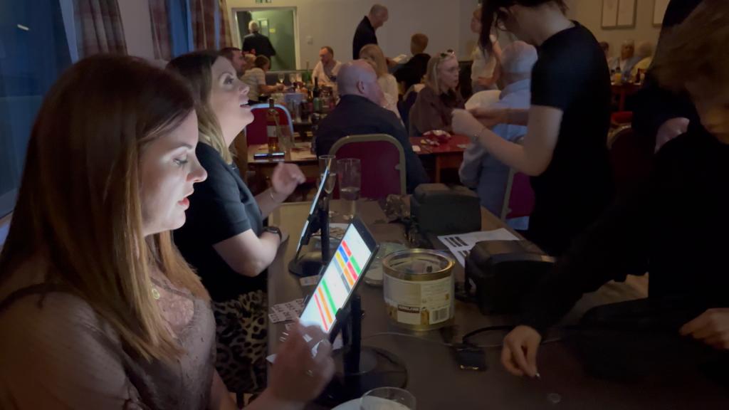 How much can you raise at a race night in Scotland — guests using Premier Disco's digital tote betting system at Curry Bowling Club