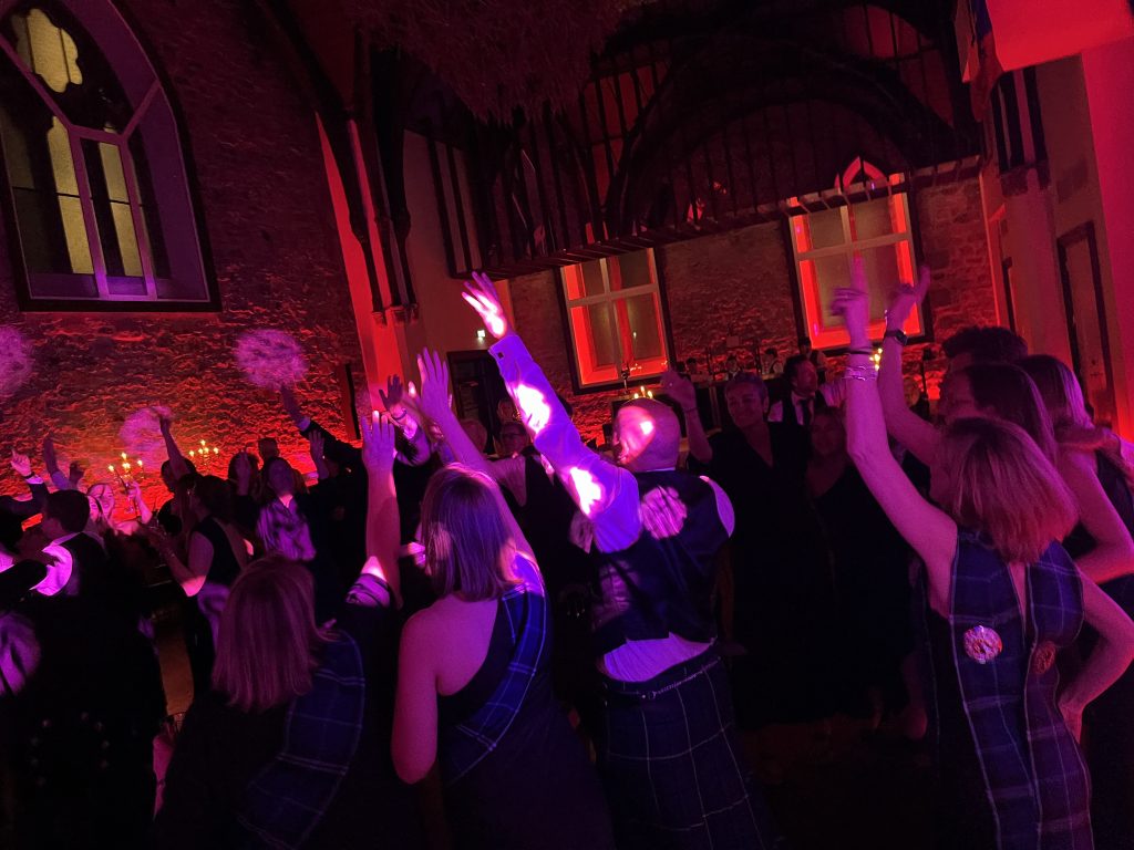 Corporate party dance floor Edinburgh — guests with hands in the air, Premier Disco