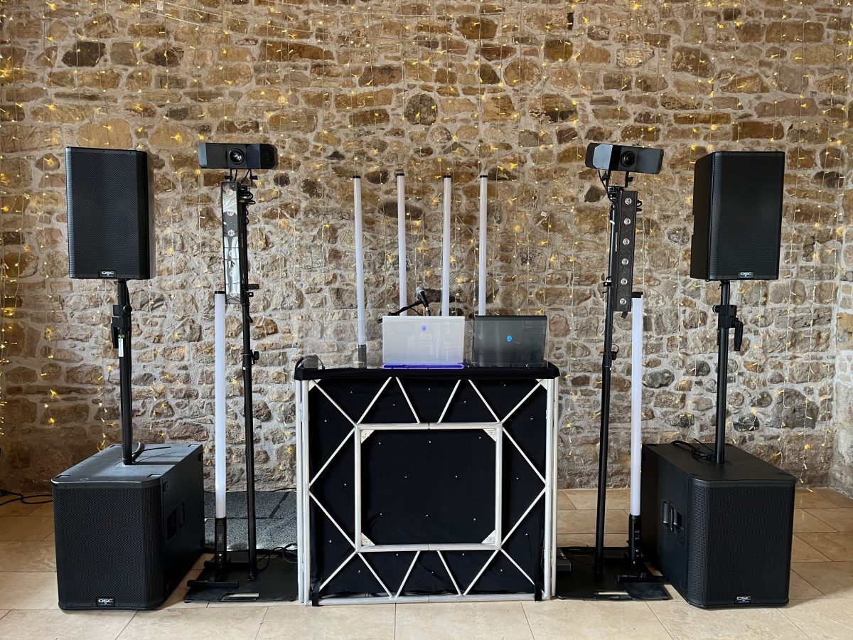 Premier Disco professional DJ equipment setup at Colstoun House wedding venue, East Lothian — QSC speakers, LED tube lights and diamond-frame booth