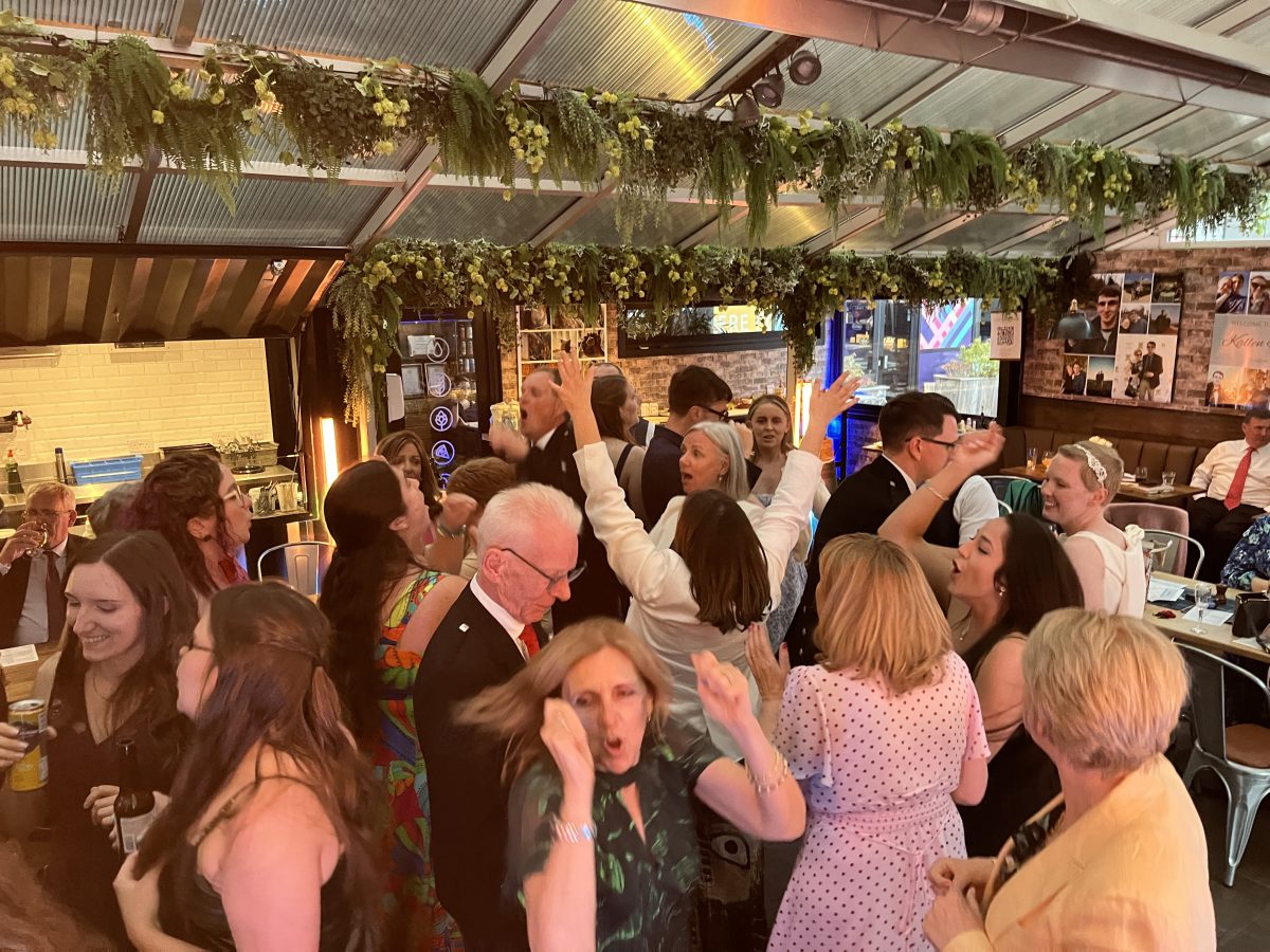 Guests mingling and dancing at Stewart Brewing wedding reception, Edinburgh