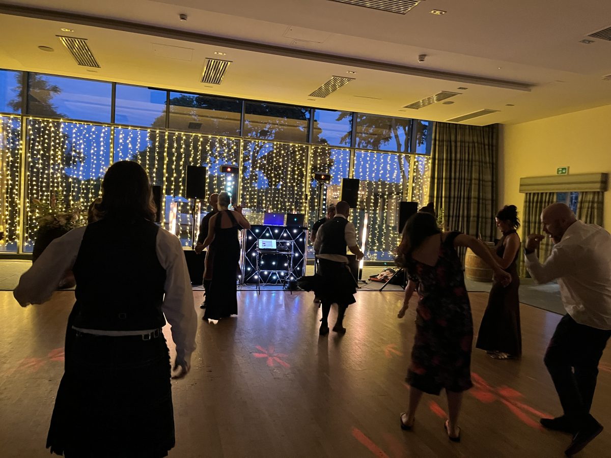 Meldrum House Hotel Set Up From Dance floor yellow - Premier Disco Scotland Dancefloor and DJ booth lit in yellow at Meldrum House Hotel wedding