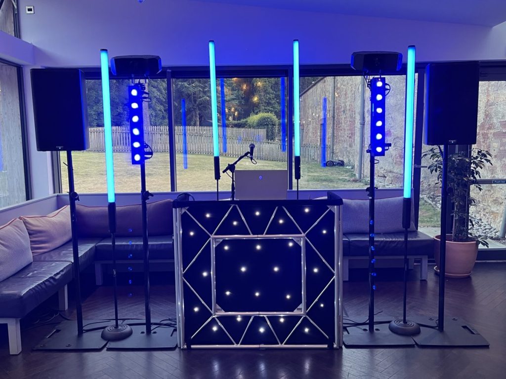 DJ setup with blue uplighting at Restoration Yard, Dalkeith Country Park