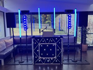 DJ setup with blue uplighting at Restoration Yard, Dalkeith Country Park