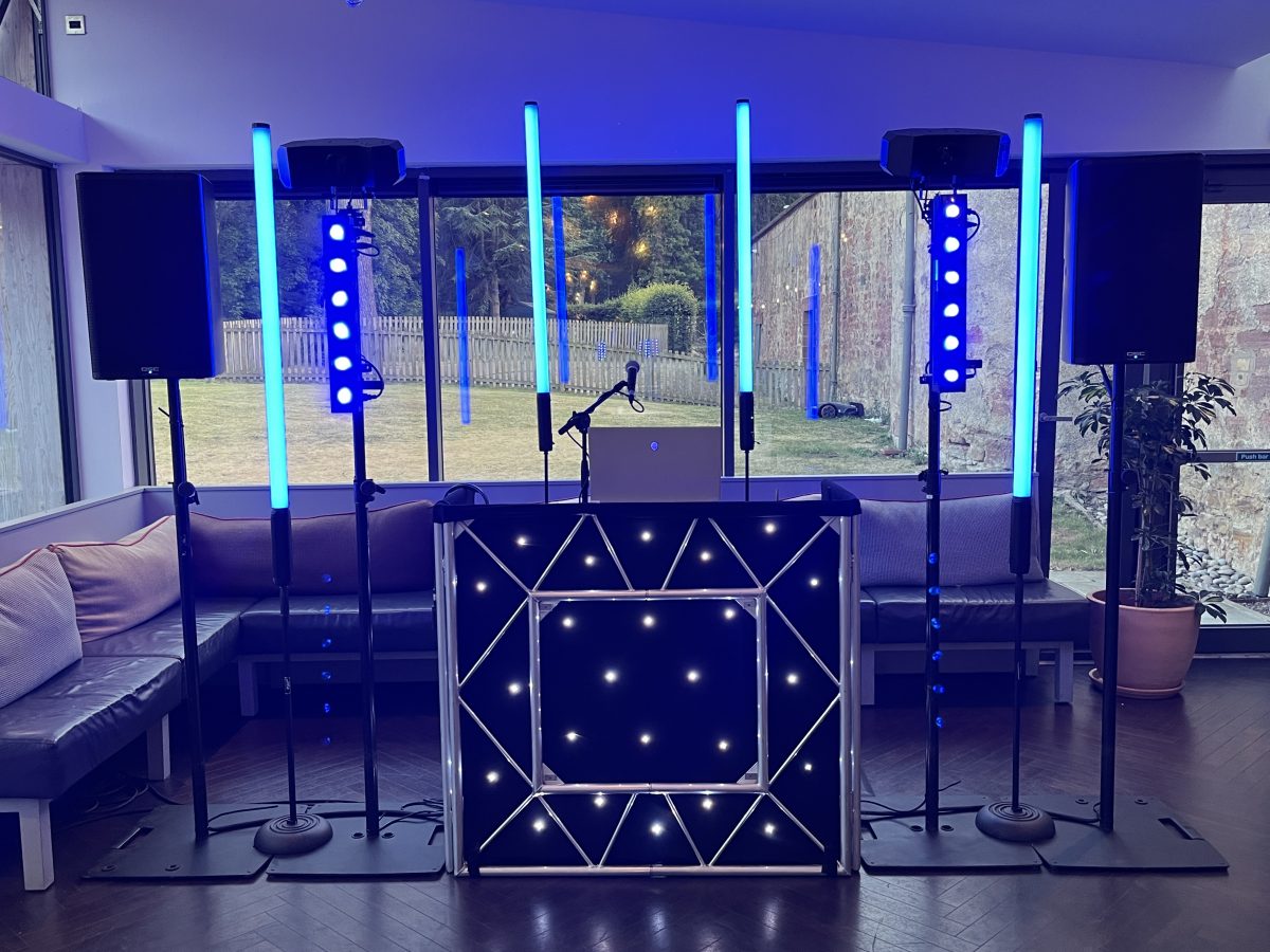 DJ setup with blue uplighting at Restoration Yard, Dalkeith Country Park