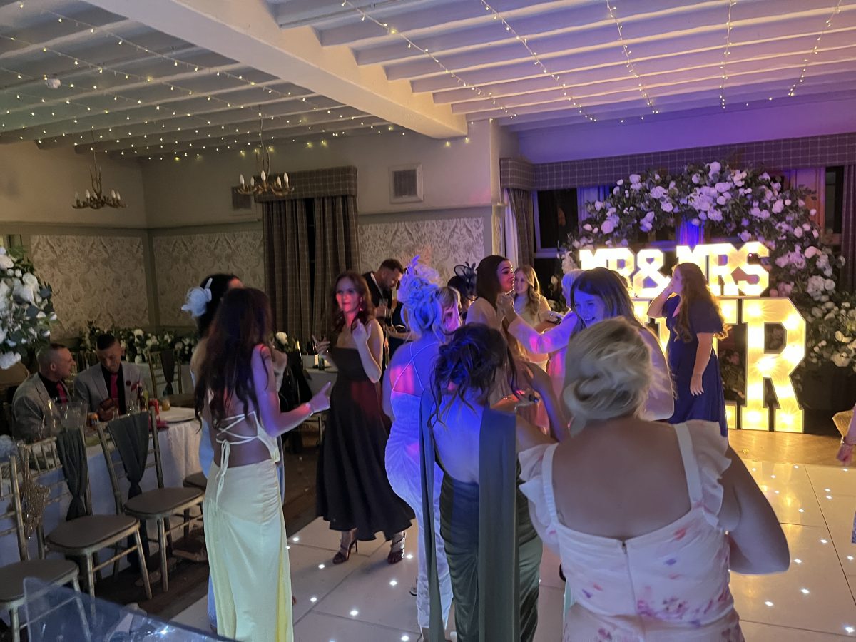 Guests dancing at a wedding reception at Stair Arms Hotel, Pathhead, while the live saxophonist played over the DJ set