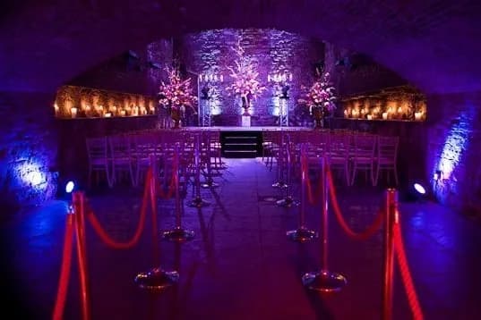 The stone vaults at The Caves Edinburgh, set up for a formal event — the venue we cover as DJ at The Caves